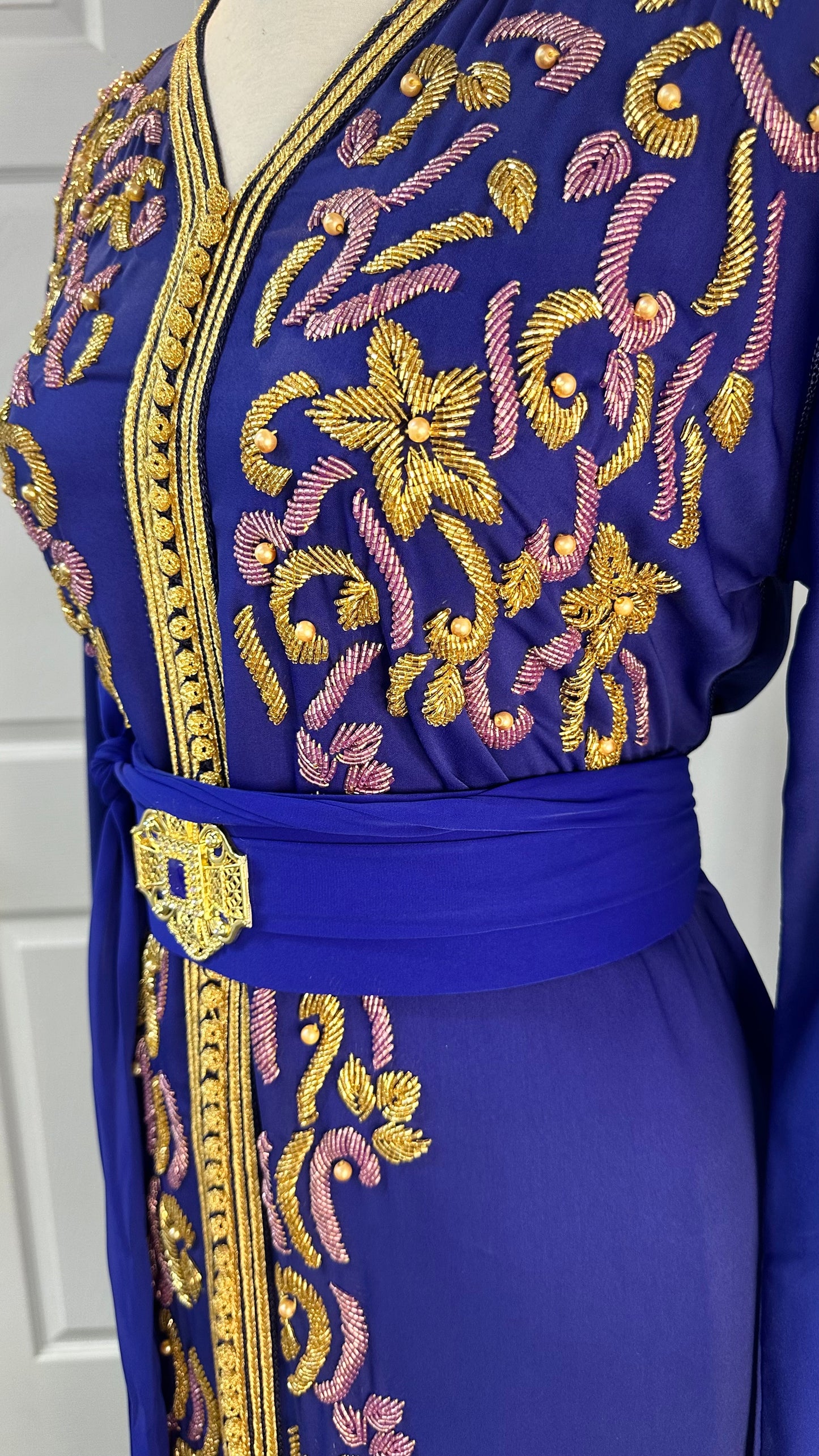 Royal blue Moroccan Kaftan made from premium crepe silk with gold and lilac embroidery, matching belt with tassels – one size fits all, available at Tendances An-Nisa Montréal and Shopanisa.ca