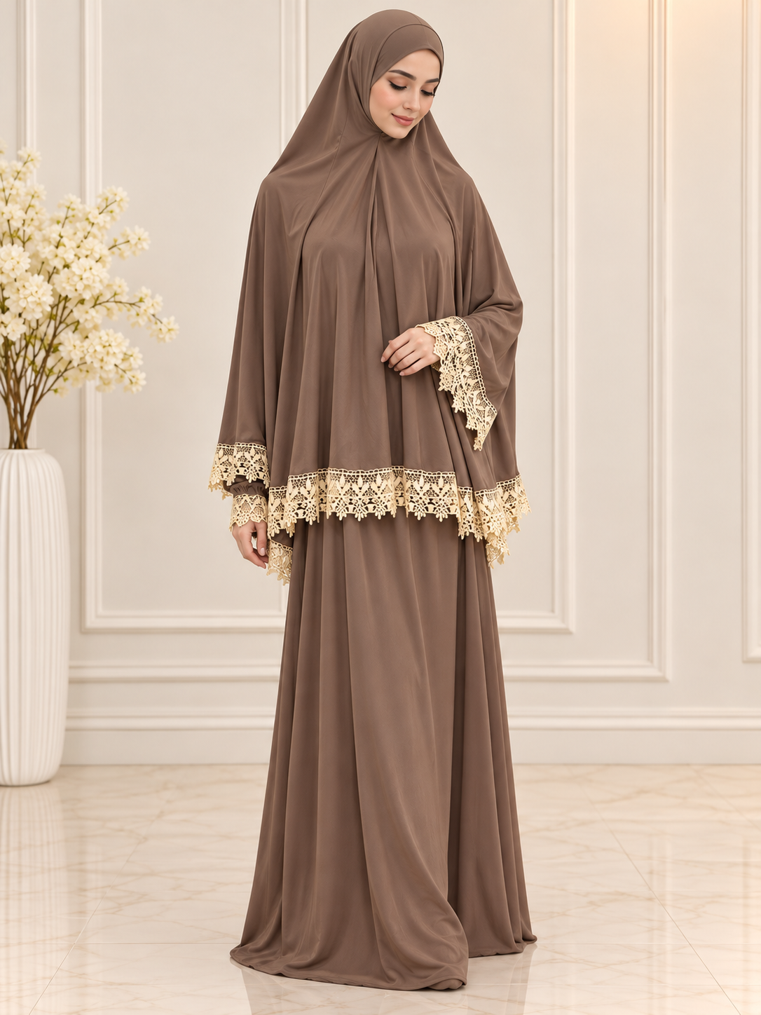 Taupe brown two-piece jilbab and khimar set with delicate cream floral lace trim on the sleeves and khimar hem, modeled by a Muslim woman in a modest full-length outfit.