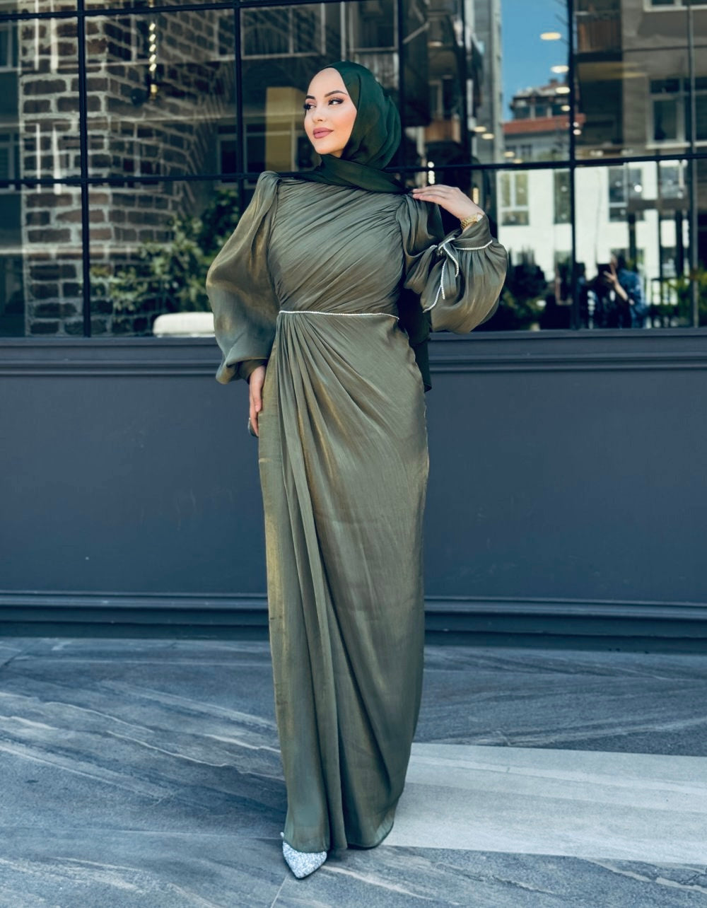 Olive Green Modest evening dress with ruched detailing, puff sleeves, and soft shimmer fabric, styled with a matching hijab
