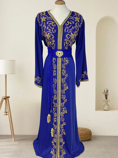 Royal blue Moroccan Kaftan made from premium crepe silk with gold and lilac embroidery, matching belt with tassels – one size fits all, available at Tendances An-Nisa Montréal and Shopanisa.ca