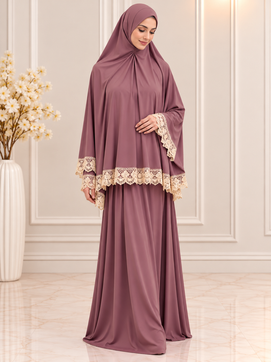 Elegant 2-piece Islamic prayer set featuring a flowing khimar, matching full-length skirt, and delicate cream floral lace trim, modeled by a Muslim woman.