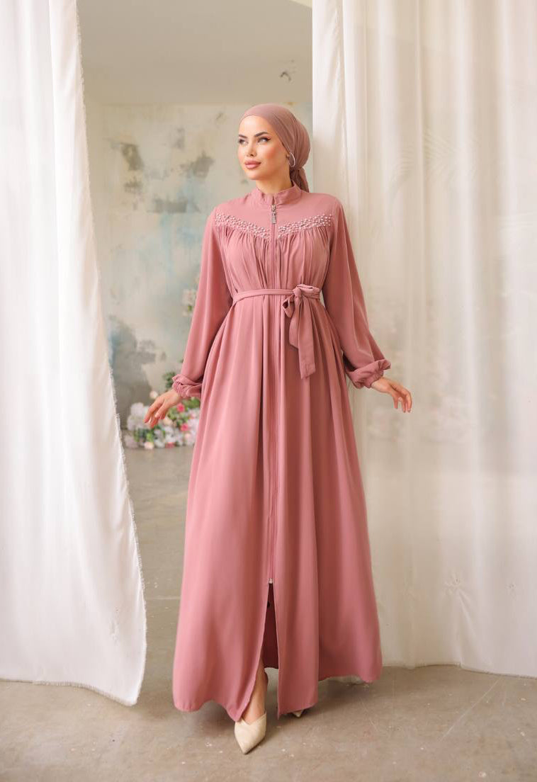 Chic rose abaya featuring a front zipper closure, side pockets, and matching waist belt for a flattering fit.
